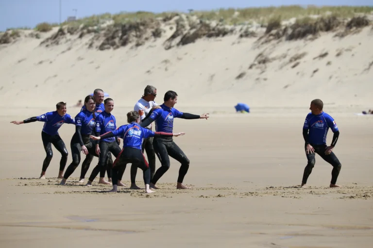Échauffement cours de surf collectif surf plage Côte Sauvage ESCS – ESCS La Palmyre Côte Sauvage